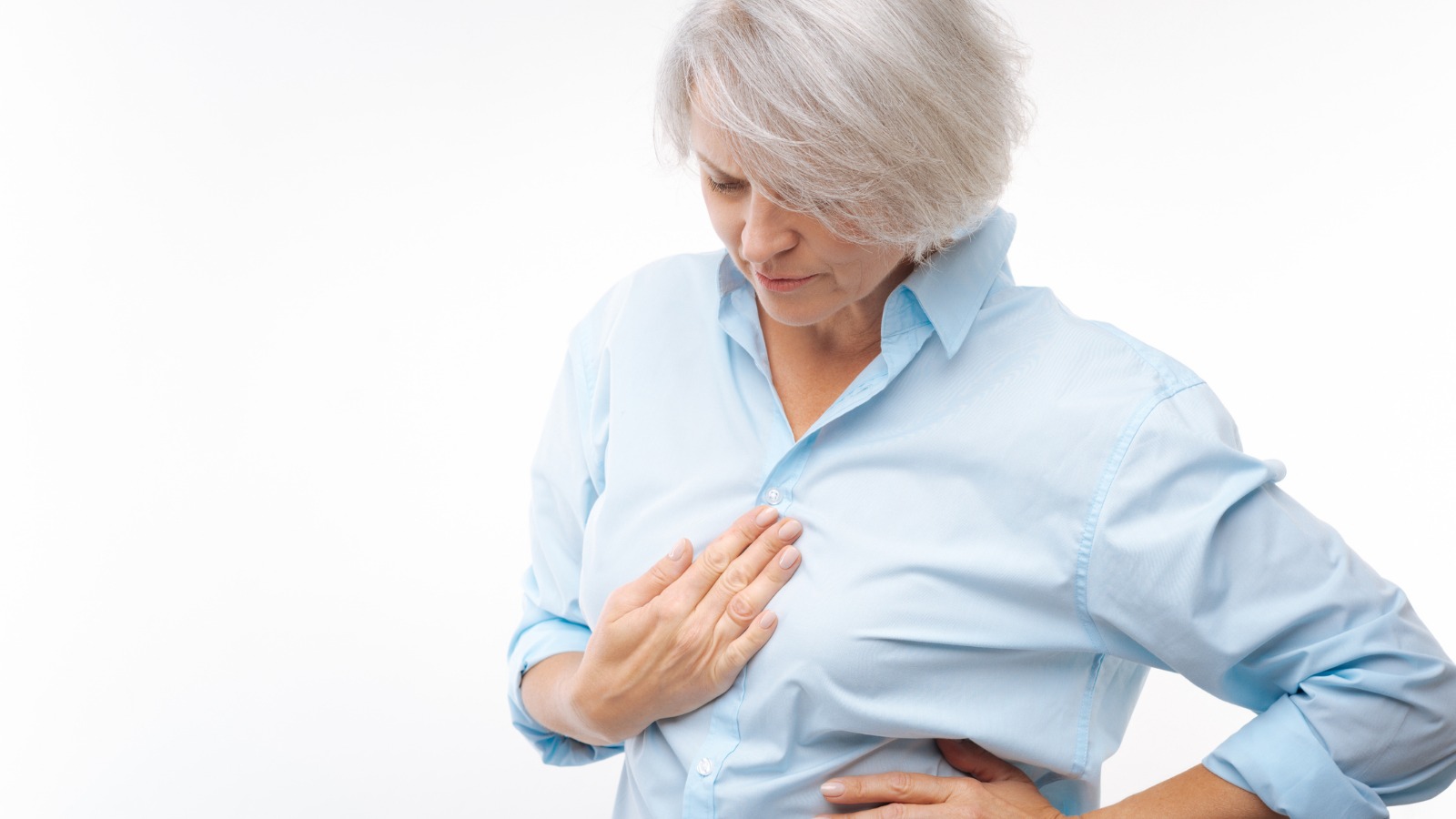 Woman grasping her heart