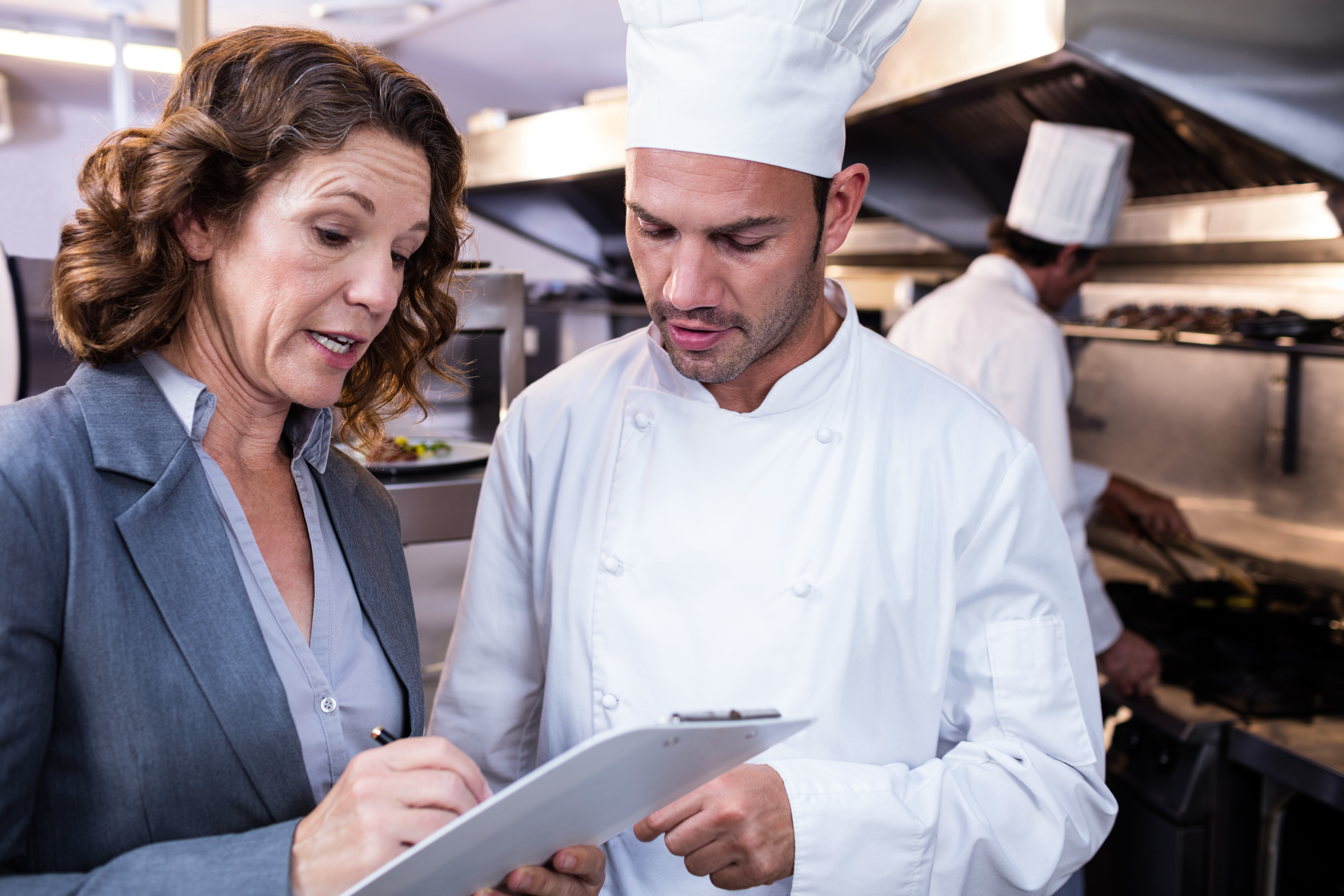 public health inspector conducting a restaurant health inspection