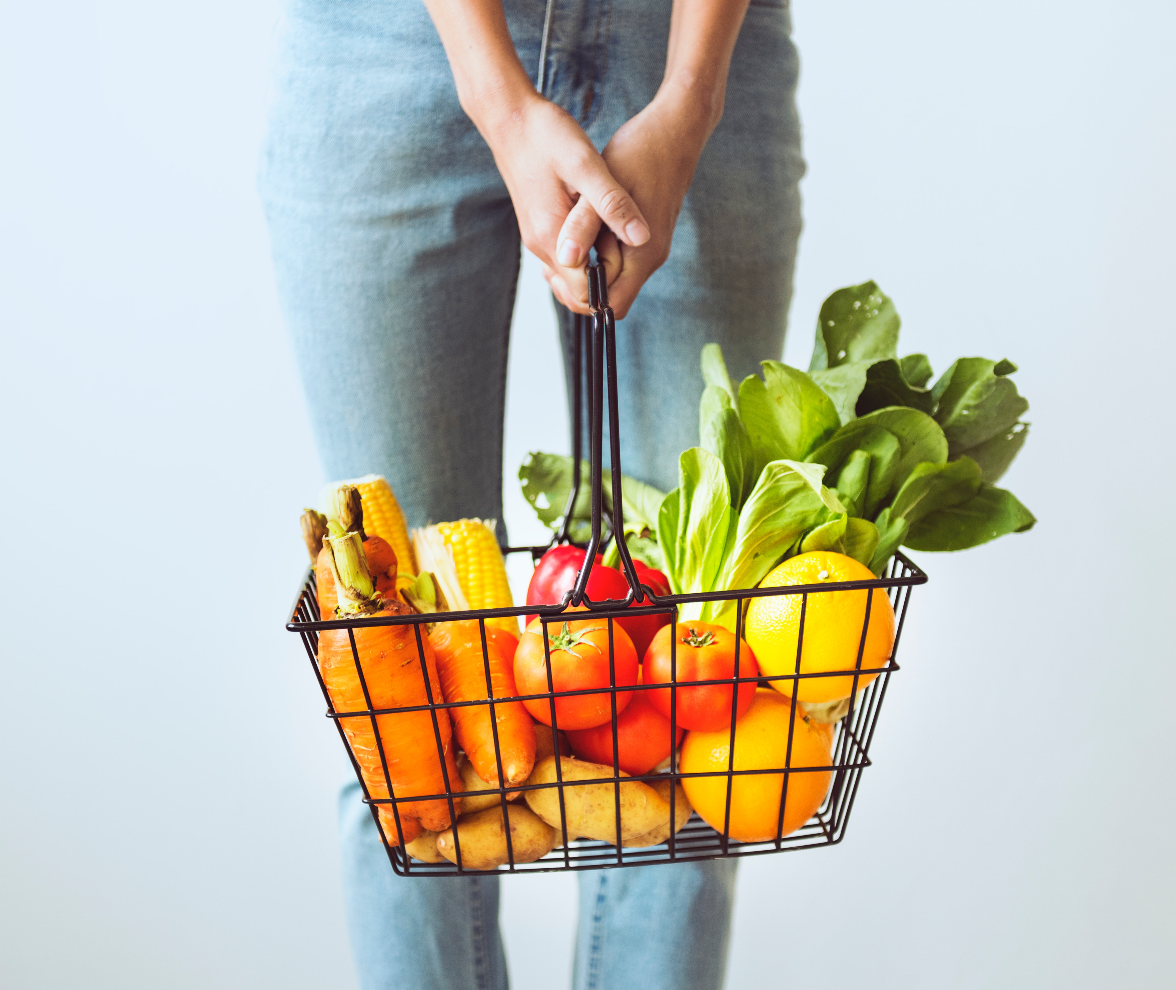 woman with basket of groceries