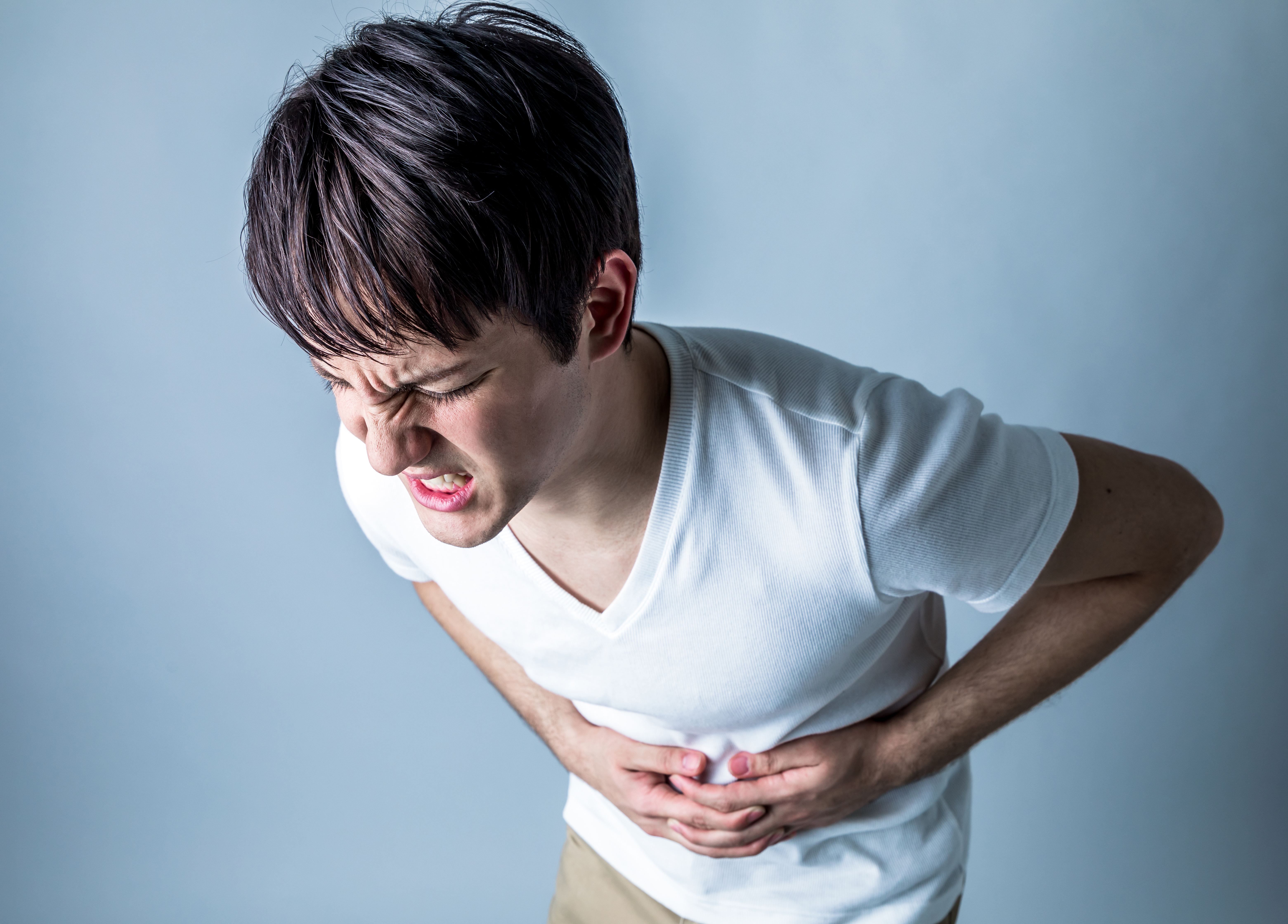 young boy with abdominal cramps food poisoning