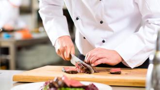 Chef using cutting board