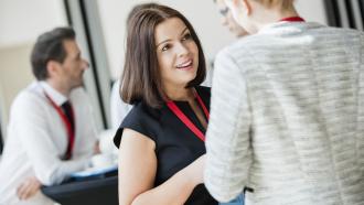 woman networking at a conference