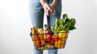 person holding grocery basket