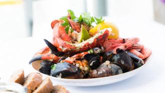 big white bowl of seafood fish and shellfish